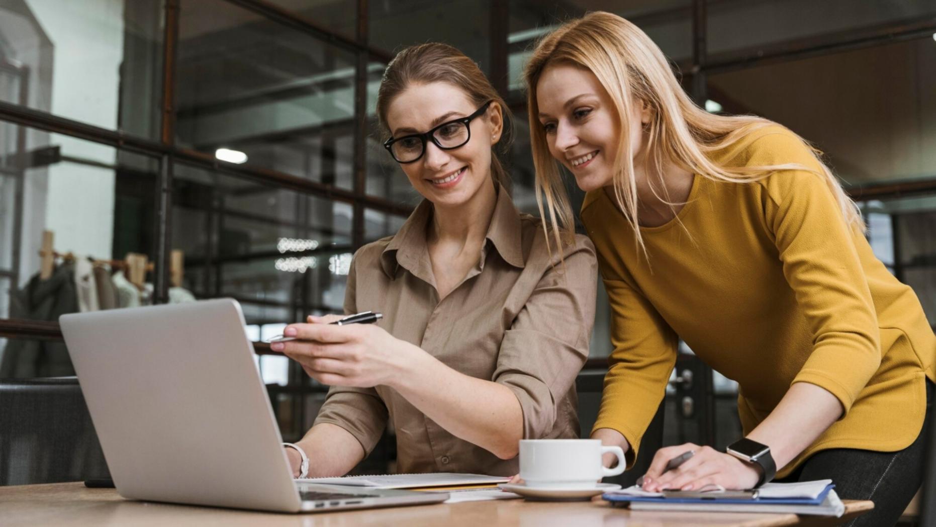 Financial analyst reviewing business reports and data charts